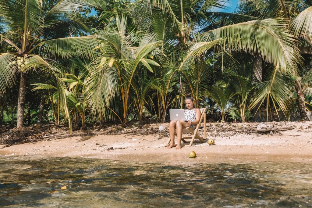 Digital Nomad working remotely on a tropical beach