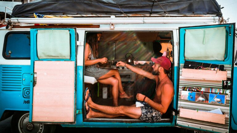 Couple sitting in their campervan